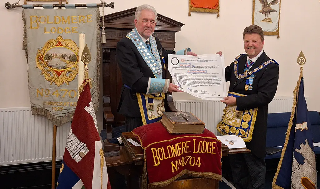 Philip Hall presents Graham Holt with Boldmere Lodge 4704 centenary certificate