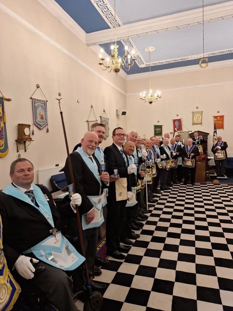 Boldmere Lodge 4704 Centenary Meeting: members of the Lodge showing their centenary jewels.