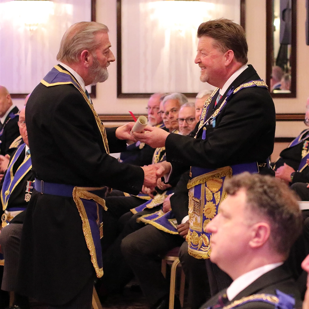 Chris Grove receives his certificate of merit