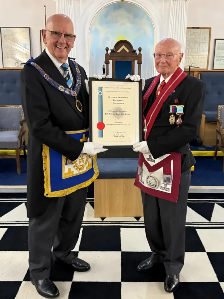 David Butcher presenting Stan Butterworth with his 60-years in Freemasonry certificate