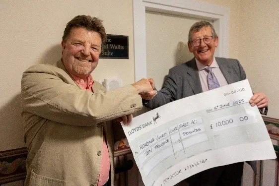 The Head of Freemasonry in Warwickshire, Philip Hall (left) and President of the Masonic Housing Association, Geoffrey Dearing, with the cheque from the Royal Arch Benevolent Fund for £10K